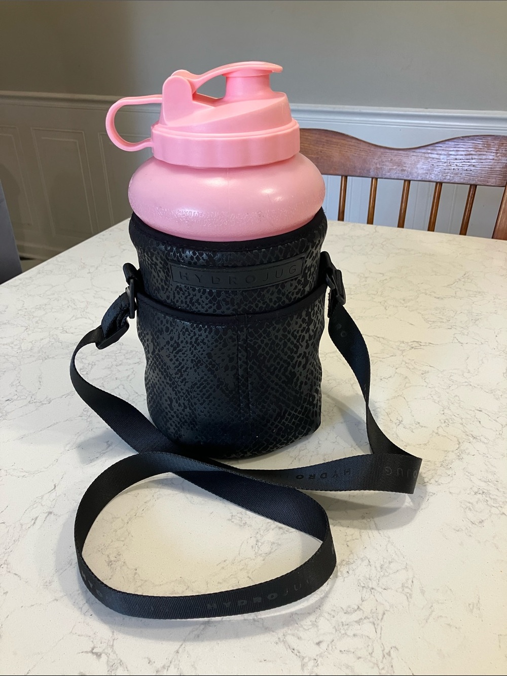 HydroJug Pink Bottle Carrier with Black Textured Crossbody Strap